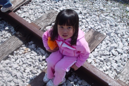 Kasen sitting on the tracks